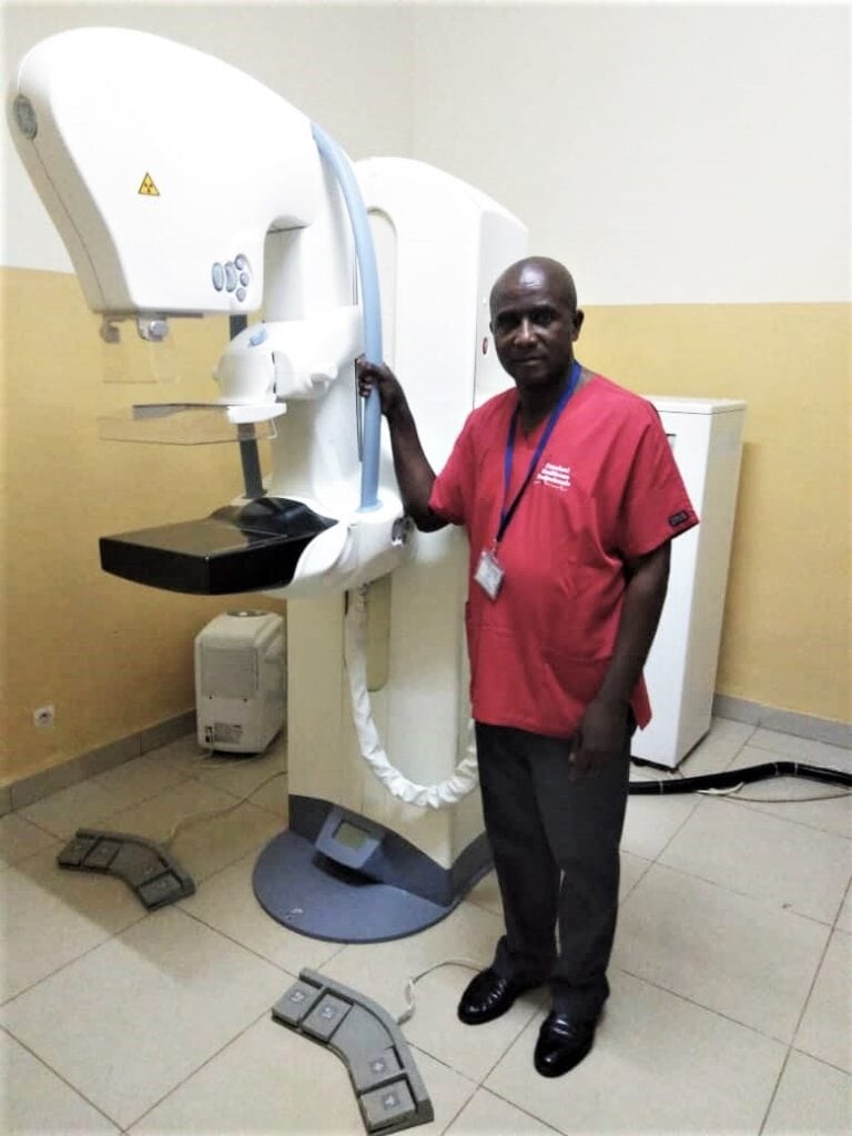 Happy DirectMed Imaging customer from  Congo with his mammography machine. GE Senographe Essential.